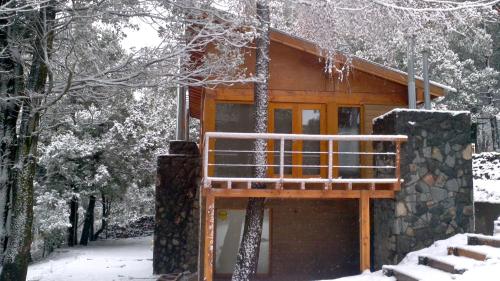 a cabin in the woods in the snow at Maria del Bosque Apart Hotel / Cabañas in San Carlos de Bariloche