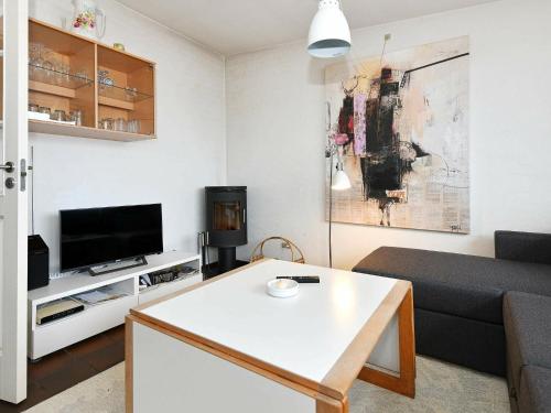 a living room with a couch and a table at 6 person holiday home in Henne-By Traum in Henne Strand