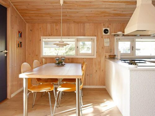 A kitchen or kitchenette at 6 person holiday home in Blokhus