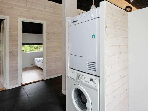 a laundry room with a washer and dryer at 6 person holiday home in Strandby-By Traum in Strandby