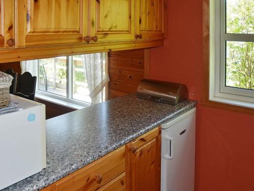 a kitchen with a counter top and a refrigerator at 6 person holiday home in Leikanger in Leikanger
