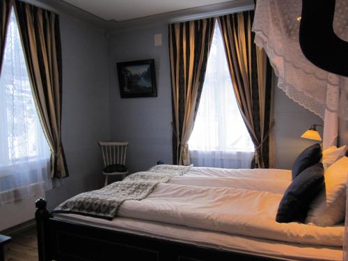 Letto o letti in una camera di Hjelle Hotel