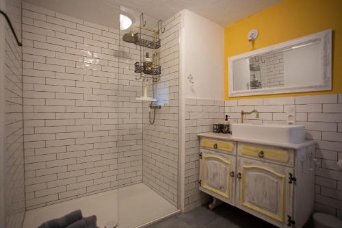 a bathroom with a sink and a shower at HIER & JETZT in Monschau City in Monschau