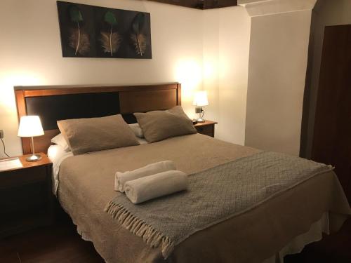 Cama ou camas em um quarto em Lucia Agustina Hotel Boutique