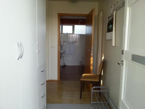 a bathroom with a walk in shower and a toilet at Thorshamar - Car Included in Reykjavík