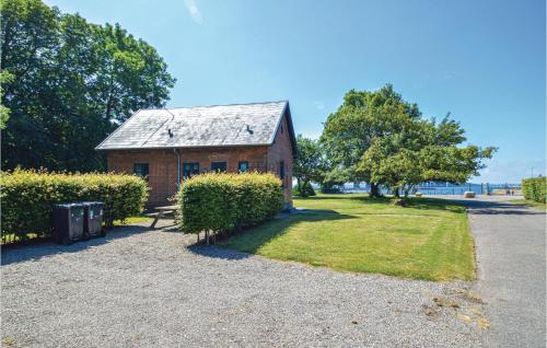 a red brick building with a metal roof at Gorgeous Home In Vordingborg With Wifi in Vordingborg