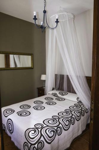 a bedroom with a bed with a canopy at Casa del Cu bano B- Biosphere Reserve in Santa Cruz de Tenerife