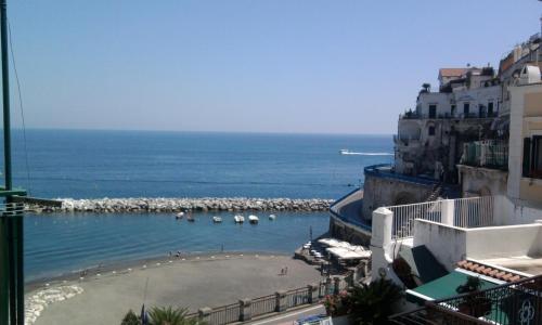 a view of a beach with boats in the water at Francesca House in Atrani