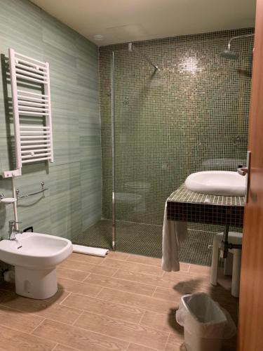Ванная комната в Hotel Il Casale Verde Resort