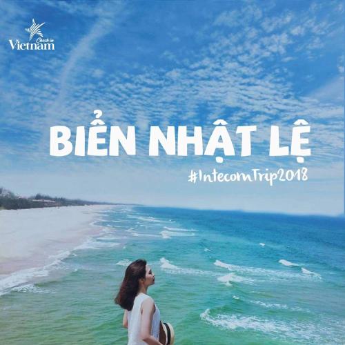 a woman standing on the beach looking at the ocean at Hoa Mai Hotel in Dong Hoi