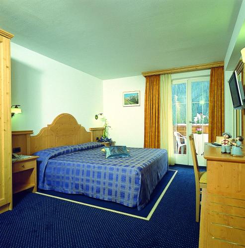 Postel nebo postele na pokoji v ubytování Hotel Alba Wellness & Spa