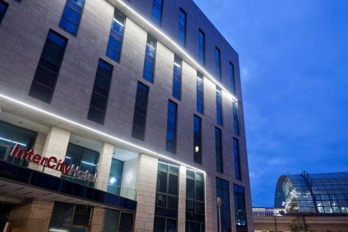 a building with a sign on the side of it at IntercityHotel Berlin Hauptbahnhof in Berlin