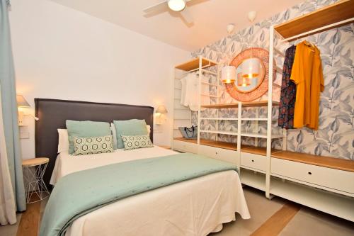 A bed or beds in a room at 70sqm private terrace in front of the sea & 107sqm brand new apartment