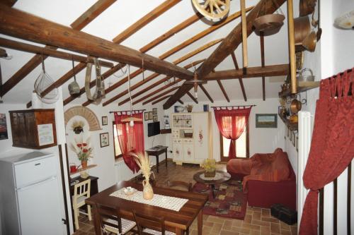 a living room with a table and a couch at La Miniera in Montefollonico