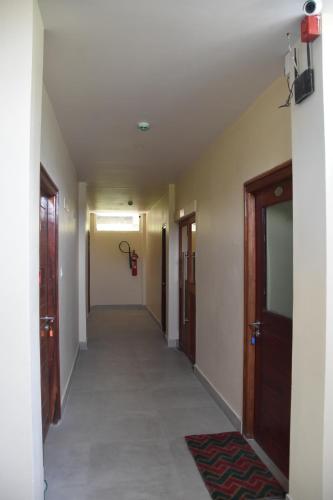 a corridor of a hallway with a hallway at Hotel Serene Palace in Port Blair