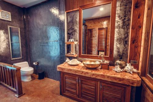 a bathroom with a sink and a toilet at Andalay Beach Resort Koh Libong in Ko Libong