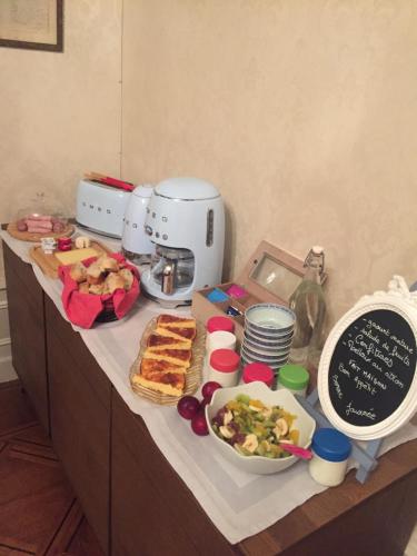 a buffet with food on top of a counter at L'Oustal in Bourges