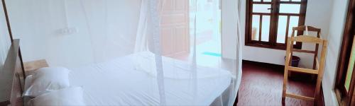 Exotic Beach Hotelにあるベッド