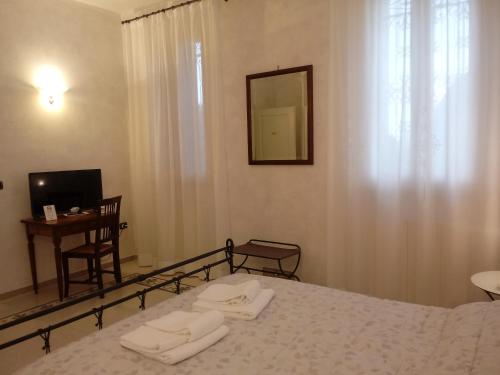 Postel nebo postele na pokoji v ubytování B&B Residence il Ciliegio , Via Villa Superiore 93 Luzzara