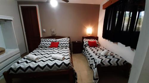 Ένα ή περισσότερα κρεβάτια σε δωμάτιο στο Hotel Uritorco