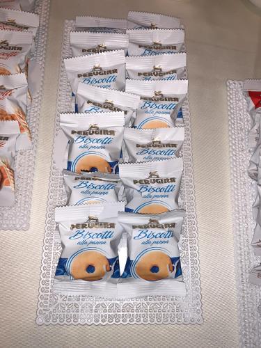 a display of packages of toilet paper on a shelf at Hotel Masaniello Luxury in Casoria