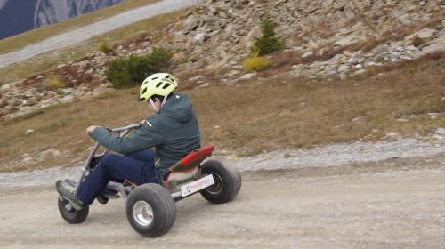 a man riding a four wheeler on the road at Landhaus Zangerl - Kobelerhof in Landeck