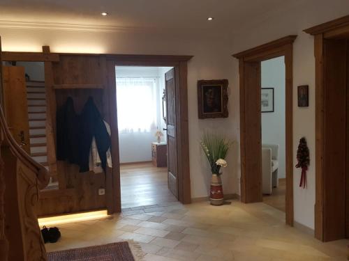 a hallway with a sliding door and a room at LuxusChalet Happy Home Tyrol in Ellmau