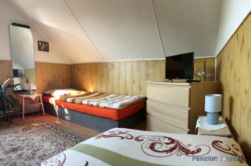 Postel nebo postele na pokoji v ubytování Penzion Wanda
