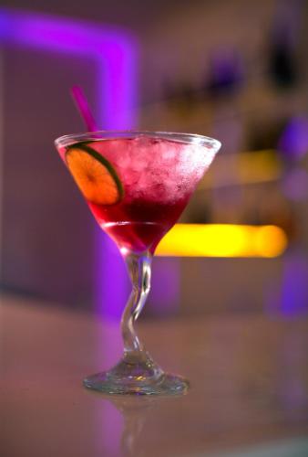 a drink in a martini glass sitting on a table at La Stella Suites in Platanes