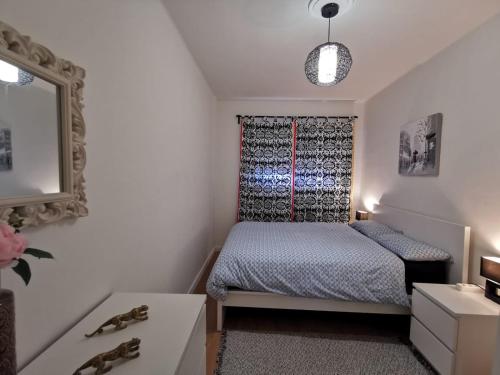 A bed or beds in a room at Casa Coqueta y confortable en Oviedo