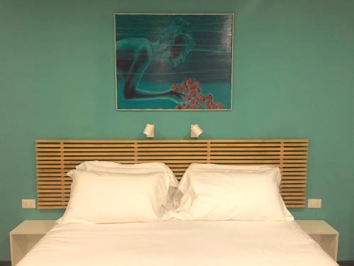 Katil atau katil-katil dalam bilik di Mimì Rooms&Studios