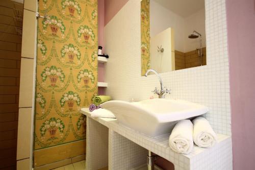 a bathroom with a sink and a mirror at Villa URSULA in Grižane