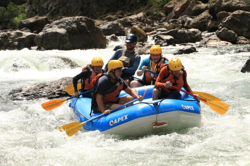 a group of people in a raft on a river at Bella Vista Ranch Ecolodge in Turrialba