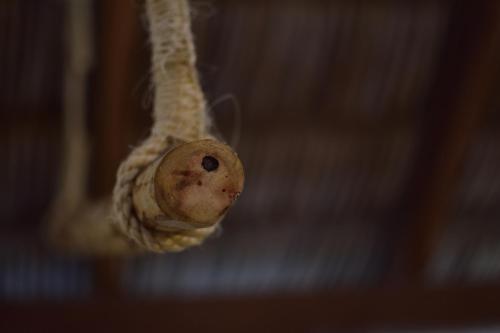 a small object is hanging from a rope at Pousada Velho Bateau in Atins