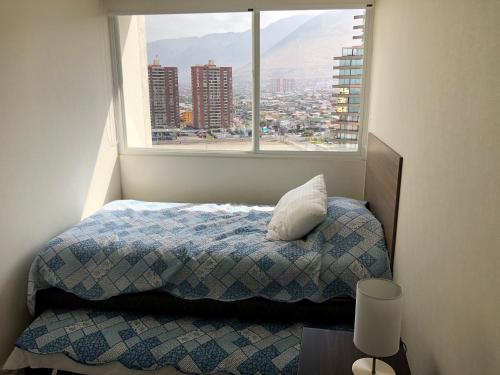 Departamento Suite en Boulevard del Mar 객실 침대