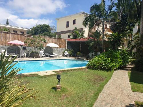 The swimming pool at or close to TipTop Hotel, Resto and Delishop