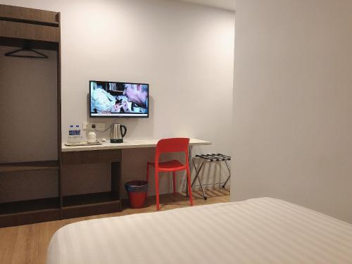 Телевизор и/или развлекательный центр в GPI HOTEL Bentong