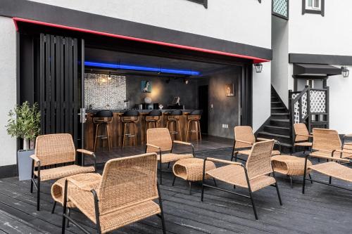 a group of chairs and a bar on a deck at Hallstatt in Suncheon