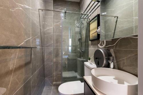 a bathroom with a shower and a toilet and a sink at 1 Private King Single Bed With En-Suite Bathroom In Sydney CBD Near Train UTS DarlingHar&ICC&C hinatown - ROOM ONLY in Sydney