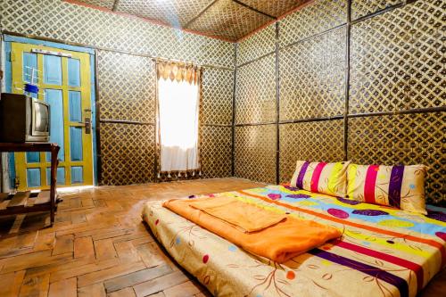 Postel nebo postele na pokoji v ubytování Larasati Homestay