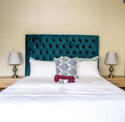 Ένα ή περισσότερα κρεβάτια σε δωμάτιο στο Pro Active Guest House