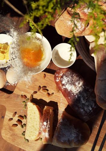 a plate of food with bread and eggs on a table at Yakamoz Erhai Hotel in Dali