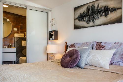 Postel nebo postele na pokoji v ubytování Apartments Nora