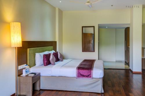 Cama o camas de una habitación en JK Residency Cheruvathur