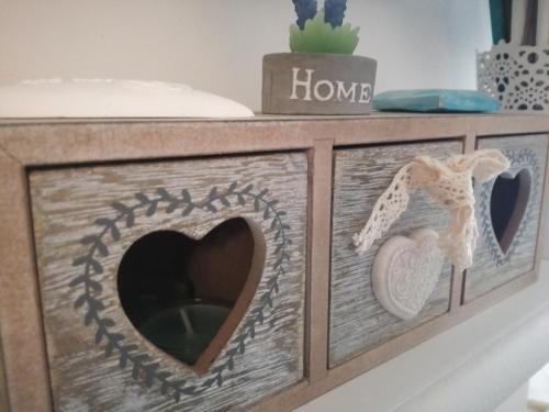 a wooden frame with a heart and a house at Romantico Rifugio in Guardiagrele