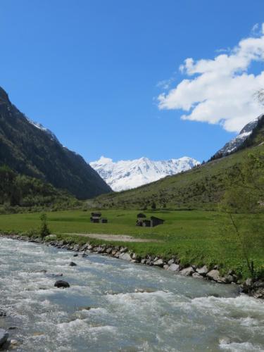a river in a valley with mountains in the background at Haus Frank Pitztal in Sankt Leonhard im Pitztal