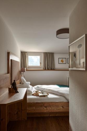 Postel nebo postele na pokoji v ubytování Charme Hotel Uridl