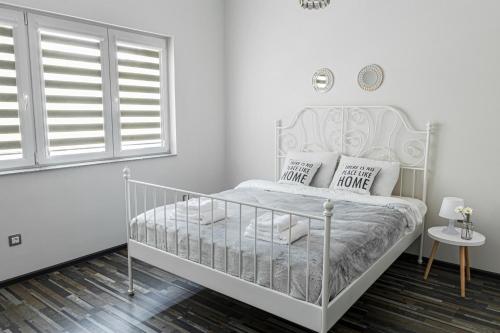 Ένα ή περισσότερα κρεβάτια σε δωμάτιο στο Gladstone suites