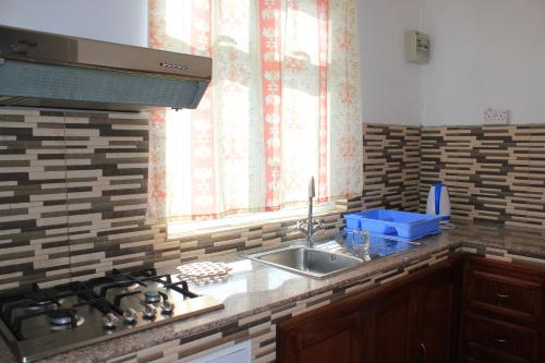 A kitchen or kitchenette at LeBovallon B&B