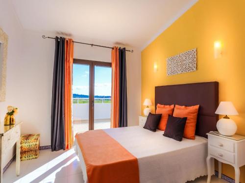 a bedroom with a bed and a large window at V3, Villa Belo Horizonte near Beach, Albufeira in Albufeira